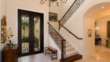 This Switchback staircase has an oak bullnose starting step with matching Old World Millwork oak newel and handrail.