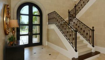 Located in Bradenton, this beautifully engineered u-shaped staircase has a Romanesque feel. With its large circular medallions amongst the oval shaped balusters. The bullnose stained starter tread creates a nice contrast to the light colored carpeted tread and risers.