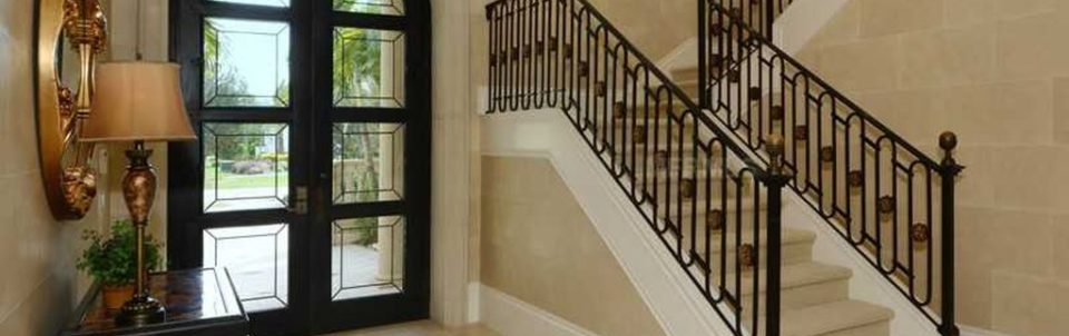 Located in Bradenton, this beautifully engineered u-shaped staircase has a Romanesque feel. With its large circular medallions amongst the oval shaped balusters. The bullnose stained starter tread creates a nice contrast to the light colored carpeted tread and risers.